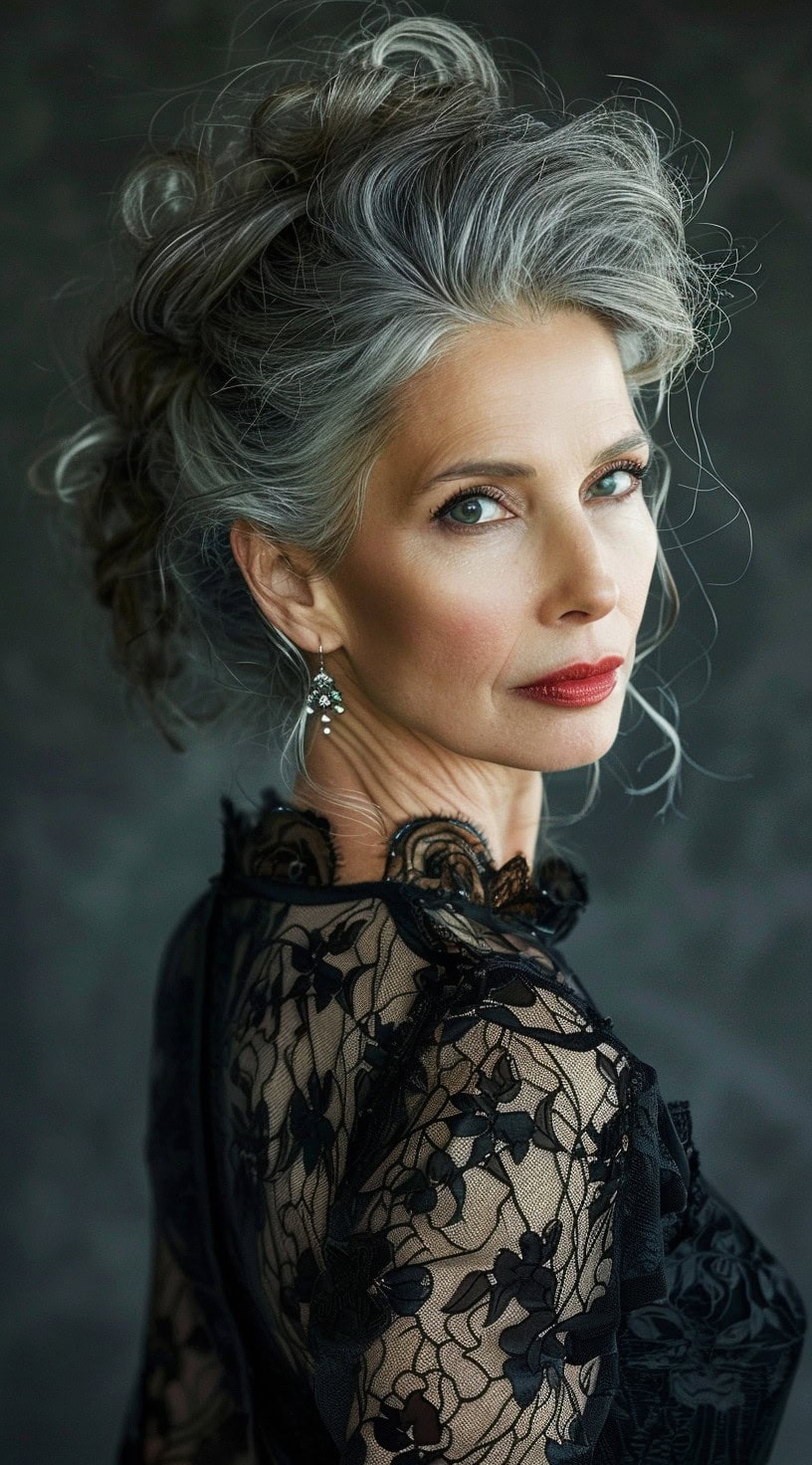 In this photo, a woman with an elegant silver updo poses in profile.