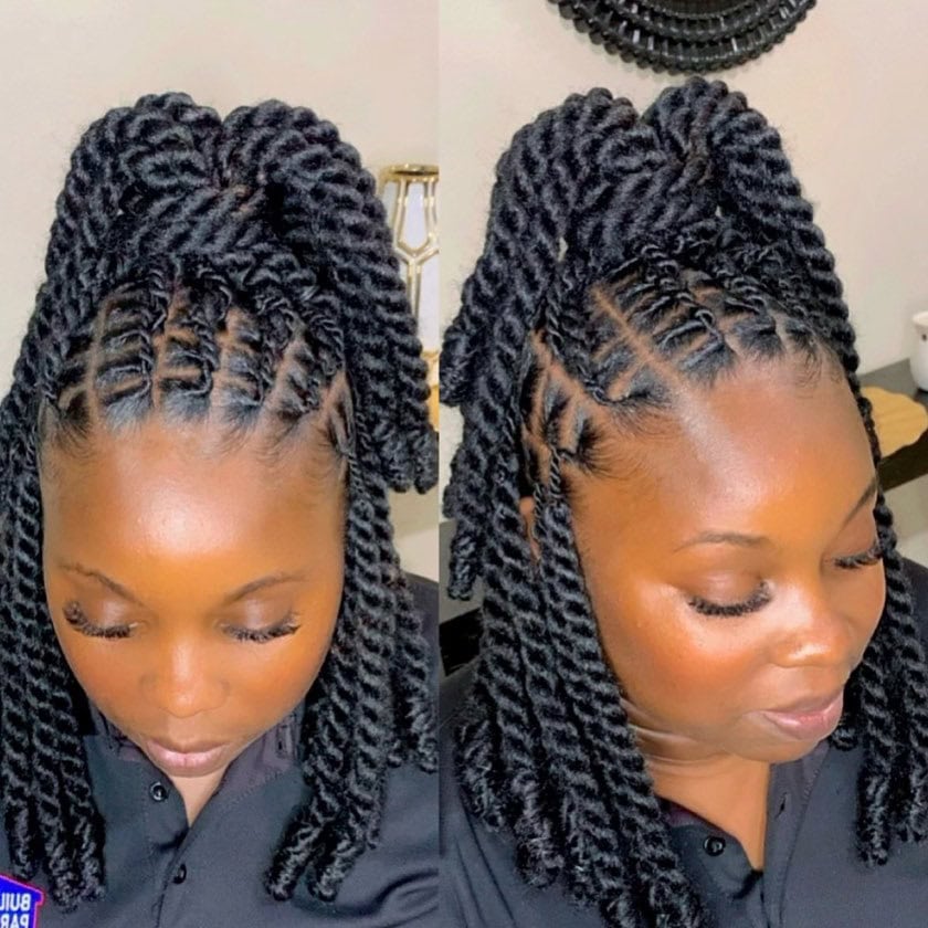 Shoulder-length invisible locs styled half-up with a high twist-out ponytail for added volume and flair.