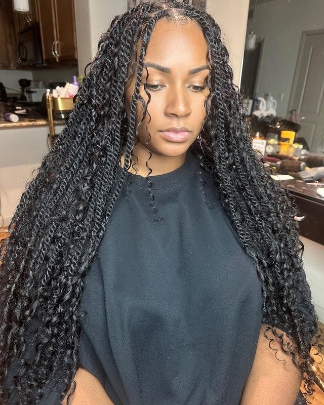 Person with long Marley twists featuring boho tips and loose strands, giving a textured and carefree look.