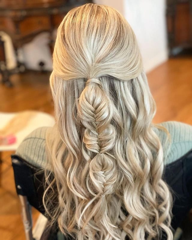 This photo features a half-up, half-down hairstyle with a bubble fishtail braid down the back.