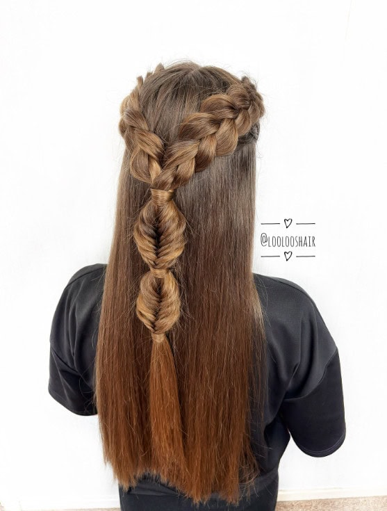 Back view of straight brown hair styled with braided crown sections feeding into a structured half-up fishtail braid.