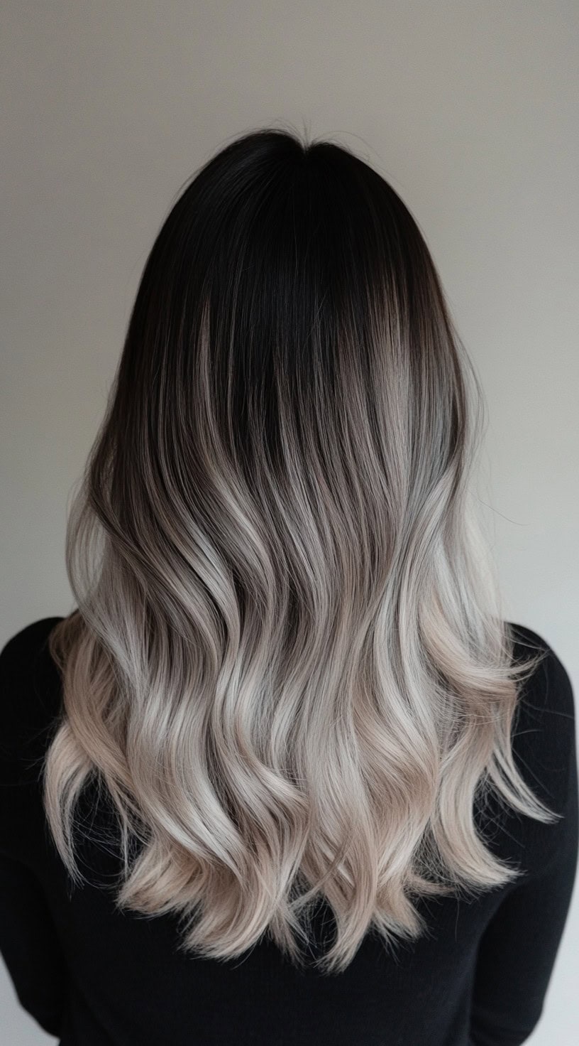 Medium-length wavy hair with dark roots and ash blonde ends.