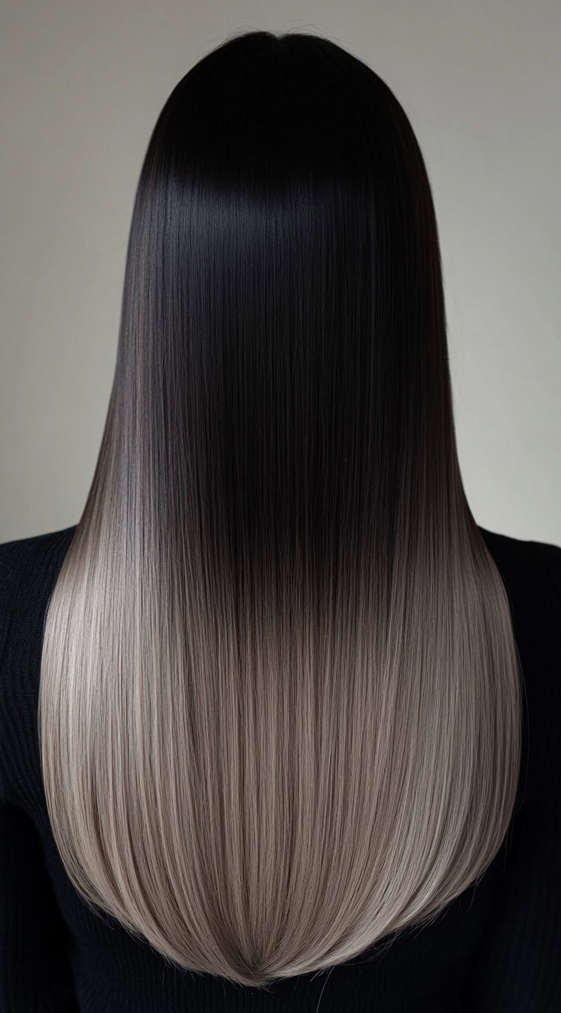 Long straight hair with dark roots transitioning to ash blonde.